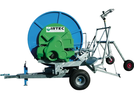 Side profile of a mobile Irtec hose reel irrigation unit isolated against a plain grey background.
